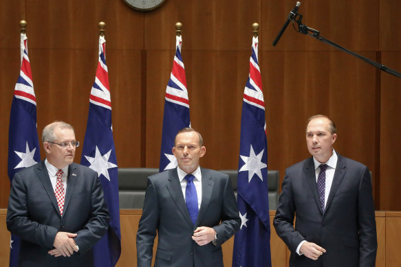 A boom microphone picks up the private conversation of Social Services Minister Scott Morrison, Prime Minister Tony Abbott and Immigration Minister Peter Dutton where they joked about rising sea levels, at Parliament House.