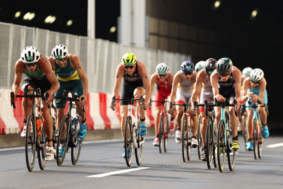 Aaron Royle, Russian Dmitry Polyanskiy and Spain’s Javier Gomez Noya emerge from a tunnel during the men’s individual triathlon on Monday.