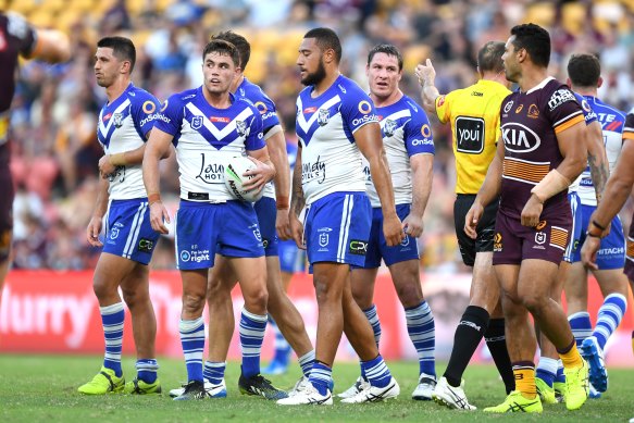 Dejected Bulldogs players during the defeat to the Broncos in March.