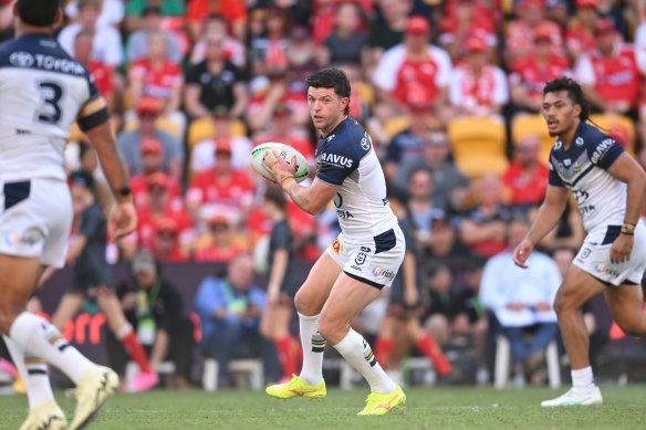 Chad Townsend runs the ball for the North Queensland Cowboys against the Dolphins.