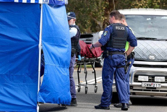 The man’s body was removed from the police tent on Fletcher Street just after 11am.