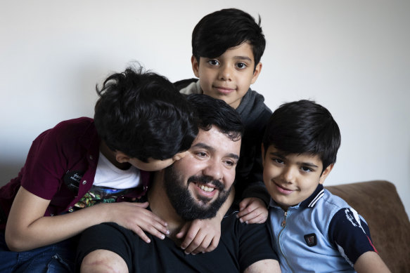 Ghanim al-Shnen with his sons at his home in Sydney earlier this year. They have since returned to Finland. 