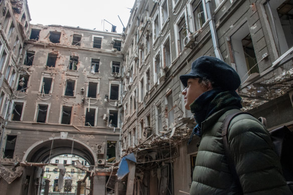 A resident looks at his apartment block destroyed in a Russian air raid in Kharkiv, Ukraine.