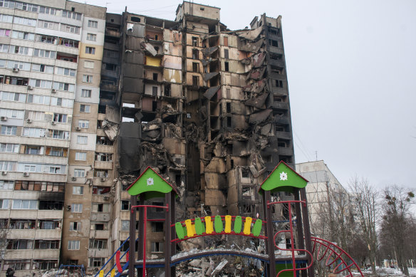 A children’s playground is seen in front of an apartment building hit by shelling in Kharkiv, Ukraine, 