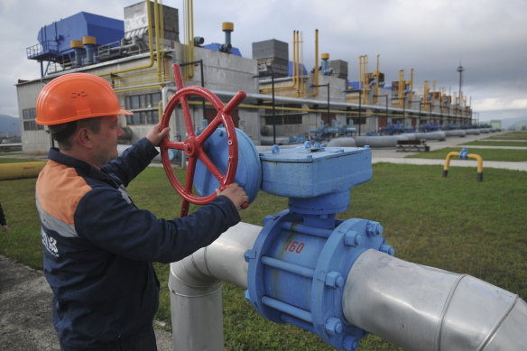 A worker at a Ukrainian gas station in Volovets, western Ukraine. The war is raising huge questions about the energy ties between Europe and Russia. 