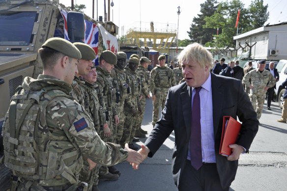 British PM Boris Johnson, then the foreign minister, greets British soldiers in Kabul, Afghanistan, 2018.