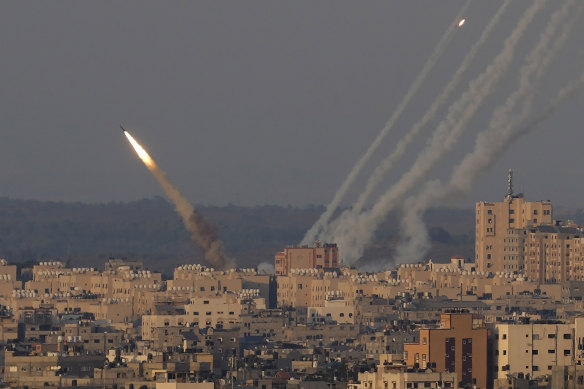 Rockets are launched from the Gaza Strip towards Israel, in Gaza City, on Sunday, August 7.
