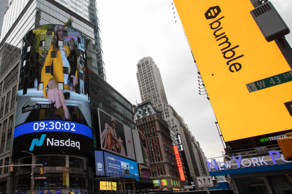 A monitor displays Whitney Wolfe Herd ringing the opening bell during Bumble’s  initial public offering  in front of the Nasdaq market site in New York on February 11, 2021.