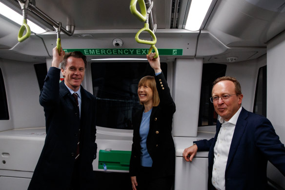 NSW Premier Chris Minns, Transport Minister Jo Haylen and Sydney Metro chief executive Peter Regan travel on a driverless train under the harbour on Monday.