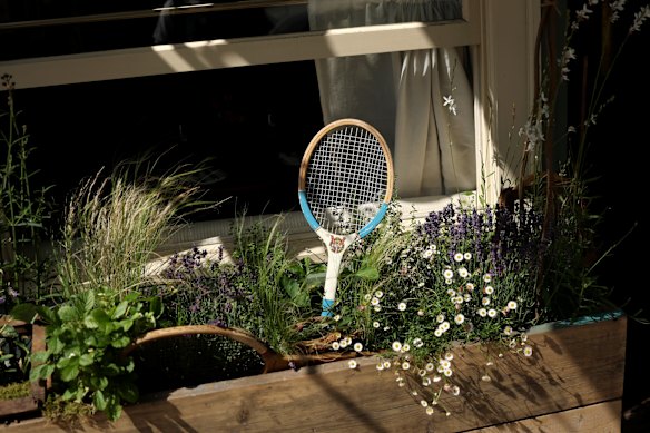 The village feel: A vintage tennis racquet is spotted in the Wimbledon village.