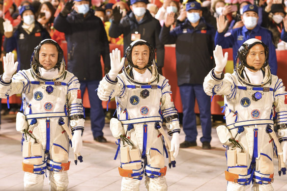 Chinese astronauts Fei Junlong, Deng Qingming and Zhang Lu wave as they attend a send-off ceremony ahead of the Shenzhou-15 manned space mission at the Jiuquan Satellite Launch Centre in northwest China on Tuesday.