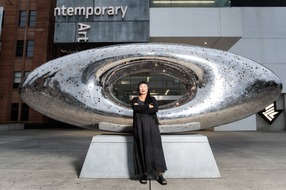 Lindy Lee with her work Secret World of a Starlight Ember, which is installed in the forecourt of the MCA.