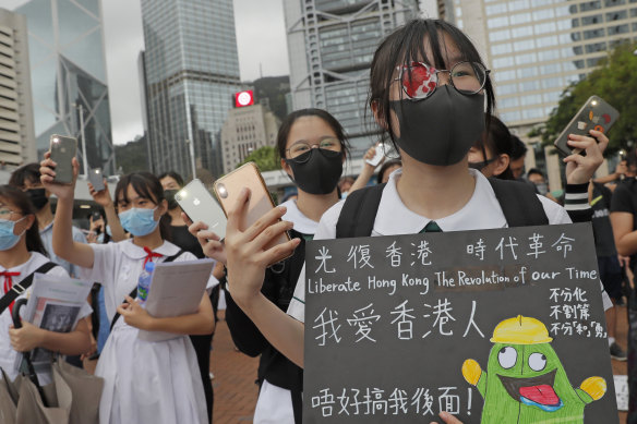 A student wears an eye patch to show solidarity with a woman injured by a police projectile in Hong Kong. 