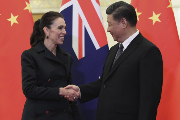 Chinese President Xi Jinping, right, and New Zealand Prime Minister Jacinda Ardern shake hands before their meeting at the Great Hall of the People in Beijing in April.