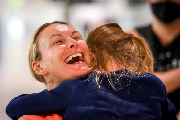 Melanie Brisbane-Schilling is reunited with her six-year-old daughter Maddie at Melbourne Airport on Wednesday morning. 