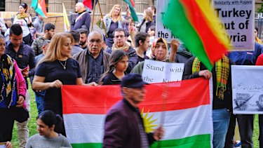 Protesters taking part in a Kurdish rally in front of the State Library in Melbourne on Saturday.