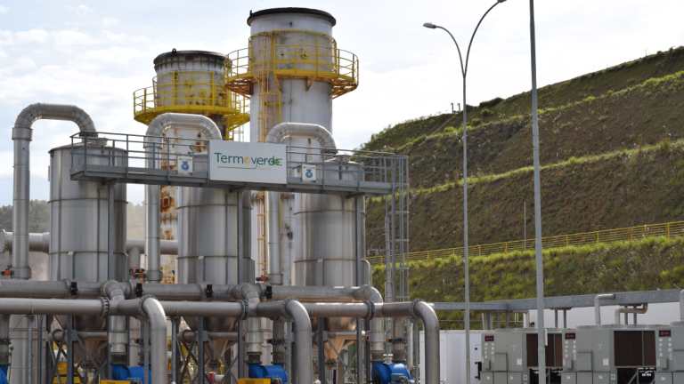 The methane is control-burnt in four large chimneys and piped into thermo engines in modular containers.