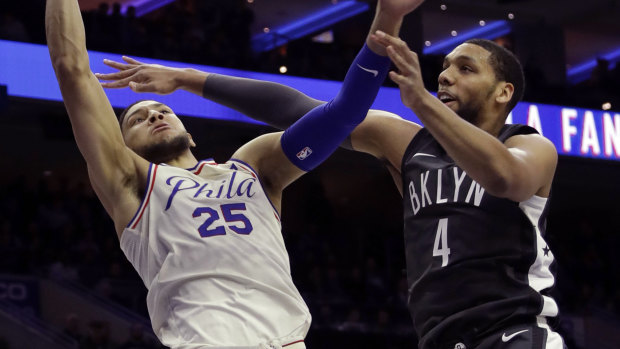 Milestone man: Ben Simmons goes up to shoot against Brooklyn Nets' Jahlil Okafor.