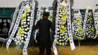 Mourners lay flowers at a memorial for victims of the Muan plane crash. 