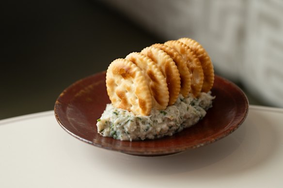 Lightly devilled crab served with Jatz crackers.