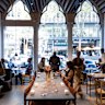 The dining room’s arched Gothic-style windows face Collins Street.