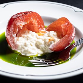 The tomato is stuffed with stracciatella in Gambino’s take on a Caprese salad.