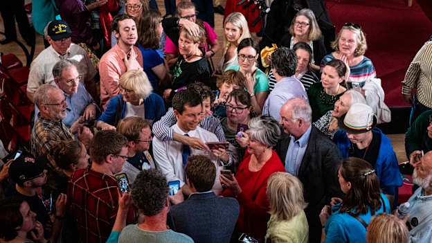 Pete Buttigieg (in white shirt and blue tie): he says his campaign makes people “feel things they haven’t felt in a while. One of them is hope. Another one of them is calm.”