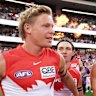 Swans academy product Isaac Heeney (left) runs onto the SCG.