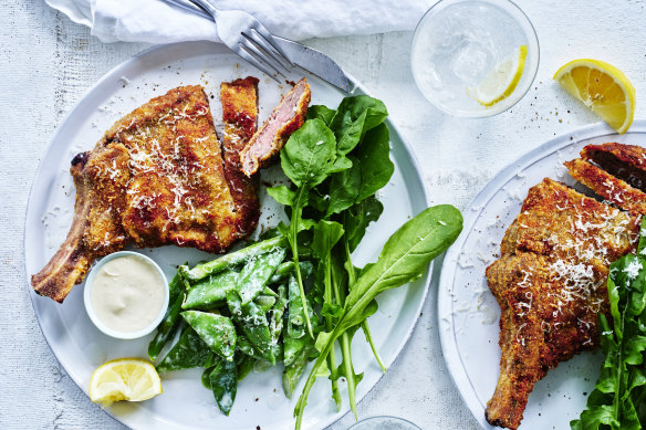 Veal cotoletta with spring vegetables and anchovy.