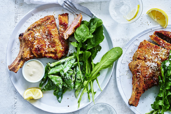 Veal cotoletta with spring vegetables and anchovy.