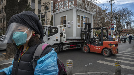 A COVID-19 testing booth is removed