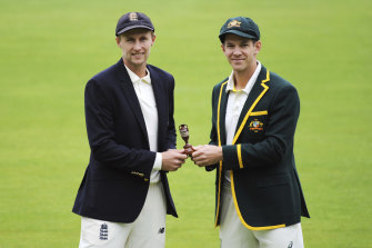 England captain Joe Root, left, and Australia’s captain Tim Paine pose with the Ashes urn before the first Test in 2019.