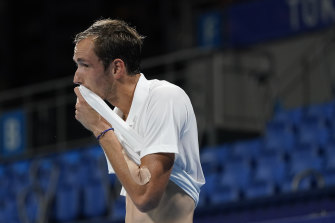 Daniil Medvedev wipes sweat from his face furing his quarter-final.
