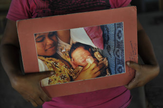 Pedro is pictured as a newborn child in the arms of his mother, Joanna.