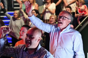 Prime Minister Scott Morrison and wife Jenny sing during an Easter Sunday service at his Horizon Church in Sydney during the 2019 election campaign.