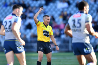 Referee Matt Cecchin signals six-again during a Storm-Warriors clash earlier this season.