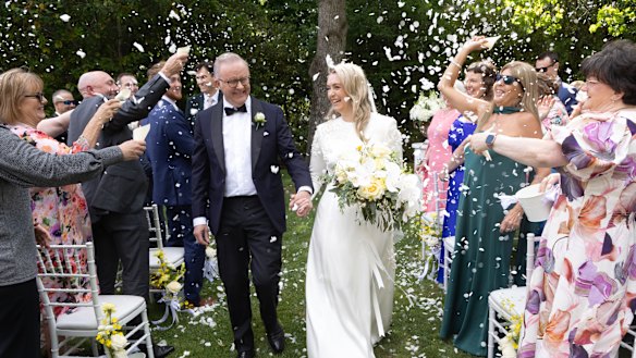 Prime Minister Anthony Albanese and Jodie Haydon walk down the aisle after getting married on Saturday in Canberra.