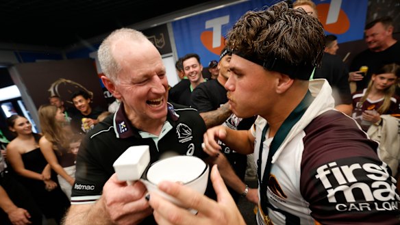Michael Maguire and Reece Walsh celebrate the 2025 premiership.