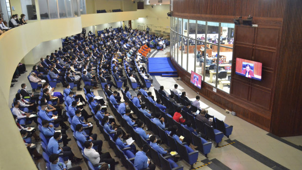 Visitors view the final proceedings of the tribunal on Thursday.