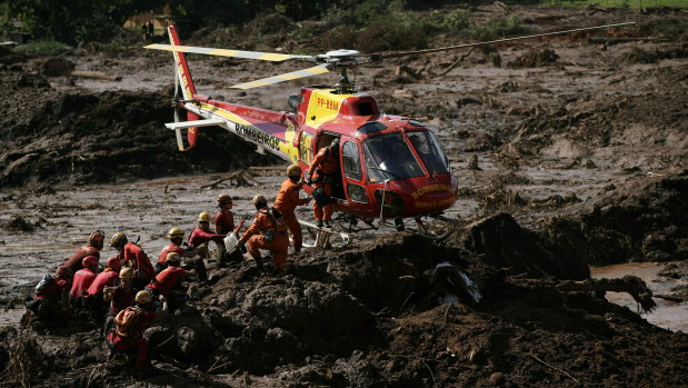 Firefighters are resupplied as they search for victims of the Vale dam collapse in Brumadinho.