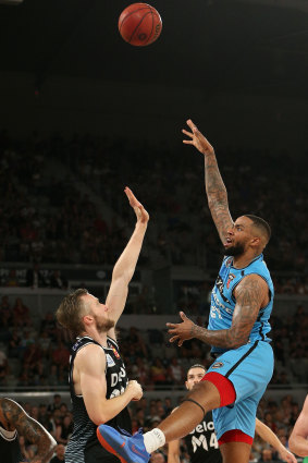 High and mighty: Breaker Shawn Long goes long over United's David Barlow.