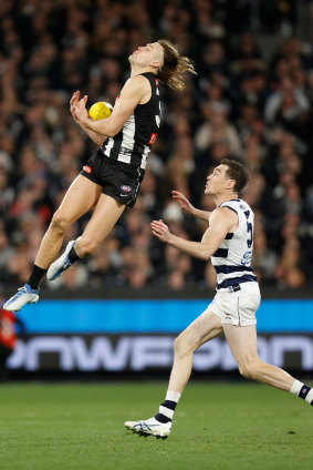 Darcy Moore flies high for the Magpies.