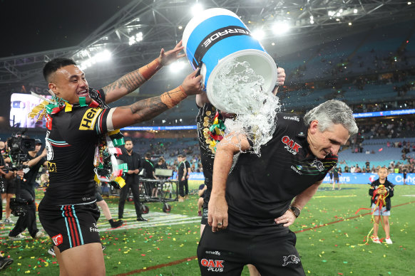 Panthers coach Ivan Cleary cops a celebratory ice bucket from Spencer Leniu.