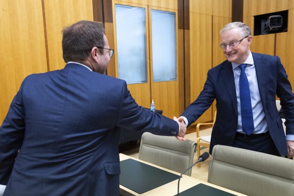 Outgoing RBA boss Philip Lowe greets Chair of Standing Committee on Economics Dr Daniel Mulino.