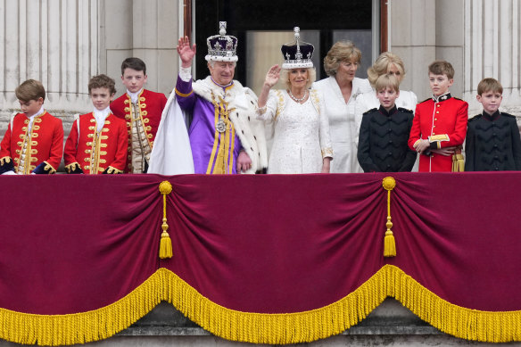 King Charles III and Queen Camilla wave to the crowds from the balcony of Buckingham Palace.