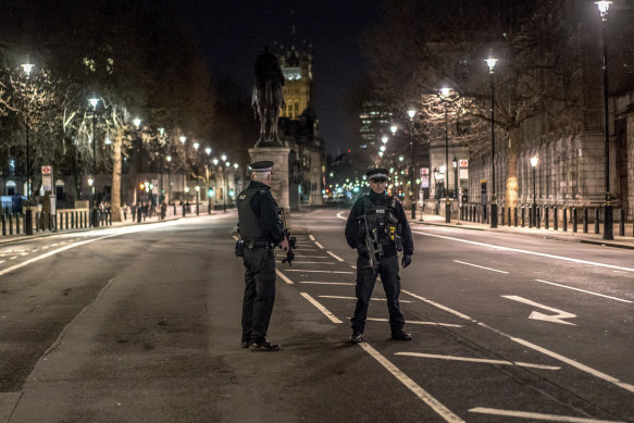 Armed police officers, two seen here in central London, are rare.
