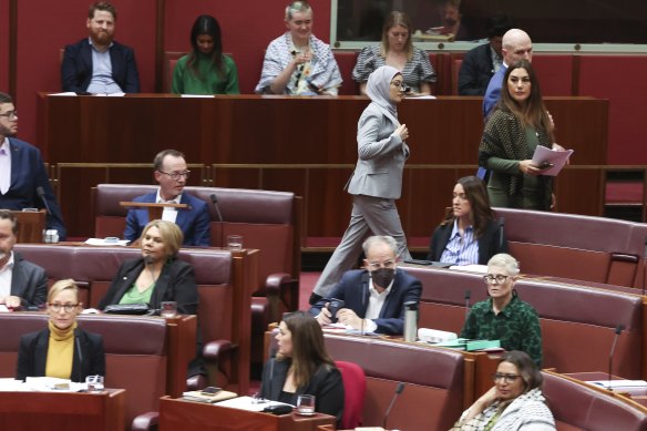 Senator Fatima Payman crosses the floor last week during a division on a motion to recognise a state of Palestine.