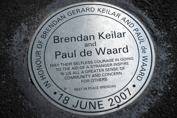 The plaque on the corner of William Street and Flinders Lane paying tribute to the heroism of Brendan Keilar, who lost his life, and Paul de Waard.