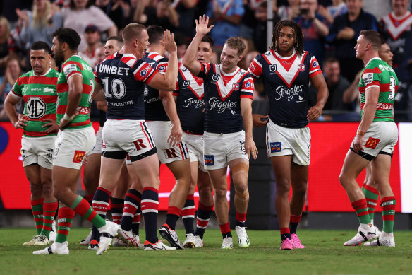 Sam Walker and the Roosters celebrate.