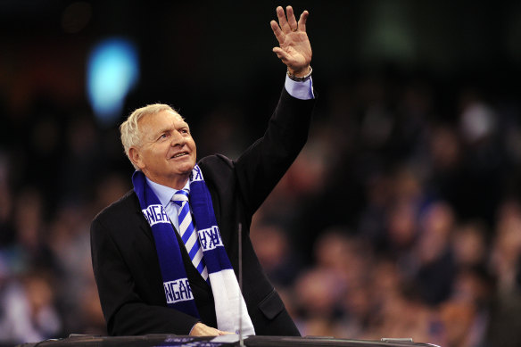 Barry Cable waves to North Melbourne fans at a game in 2012.